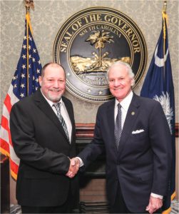Little River Board of Trustees Vice President Terry Ricketts visited with Gov. Henry McMaster during Co-op Day at the State House in February.